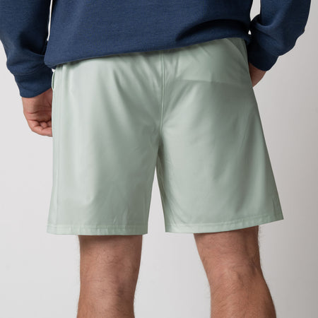 Close up image showing the back of a pair of JOOLA Men's Woven Shorts, 7 inch inseam, hushed mint.