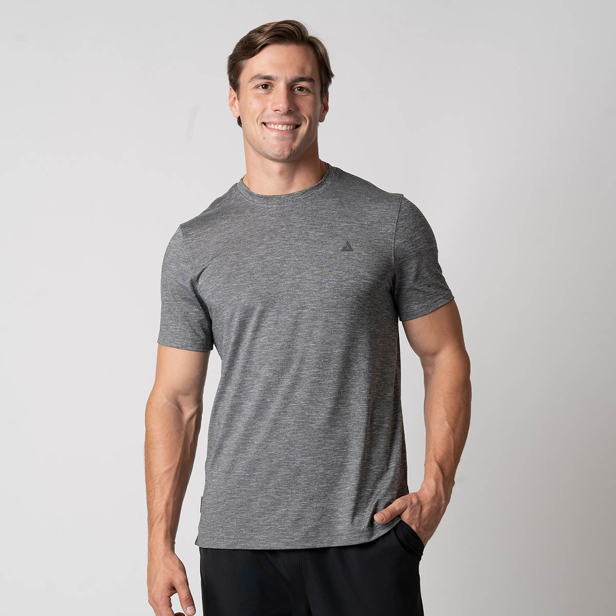 Image of a male model wearing a JOOLA Men's Club Short Sleeve Shirt, Charcoal Heather.