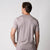 Image showing the back of a male model who is wearing a JOOLA Men's Club Short Sleeve Shirt, Dusty Mauve.