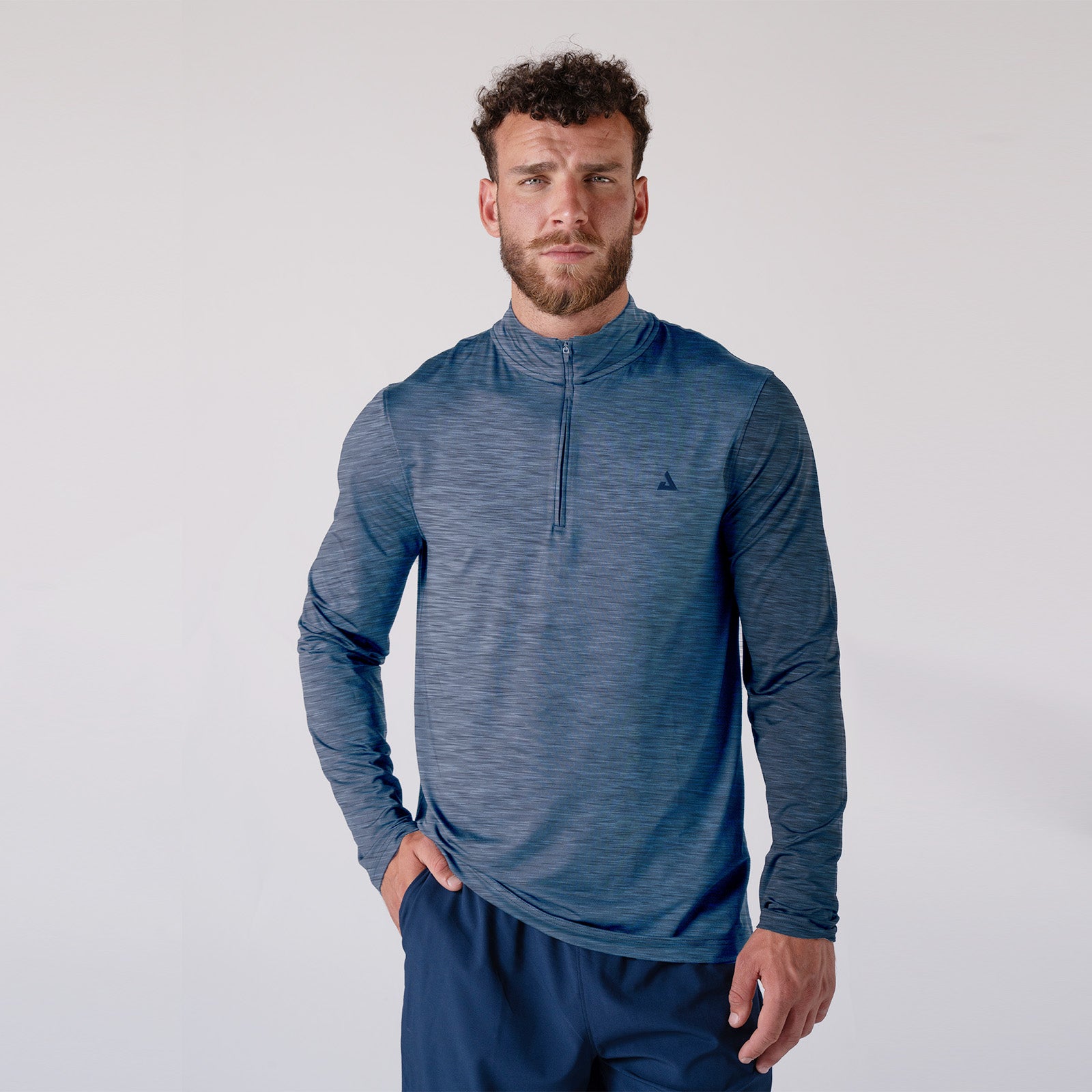 White background image, a model wearing the JOOLA Men's Quarter Zip. Navy.