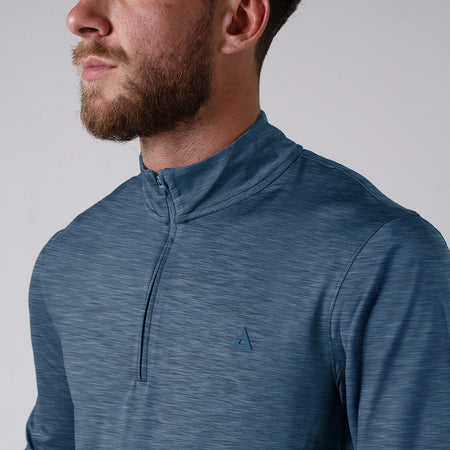 Close up image of a model wearing the JOOLA Men's Quarter Zip. Navy.