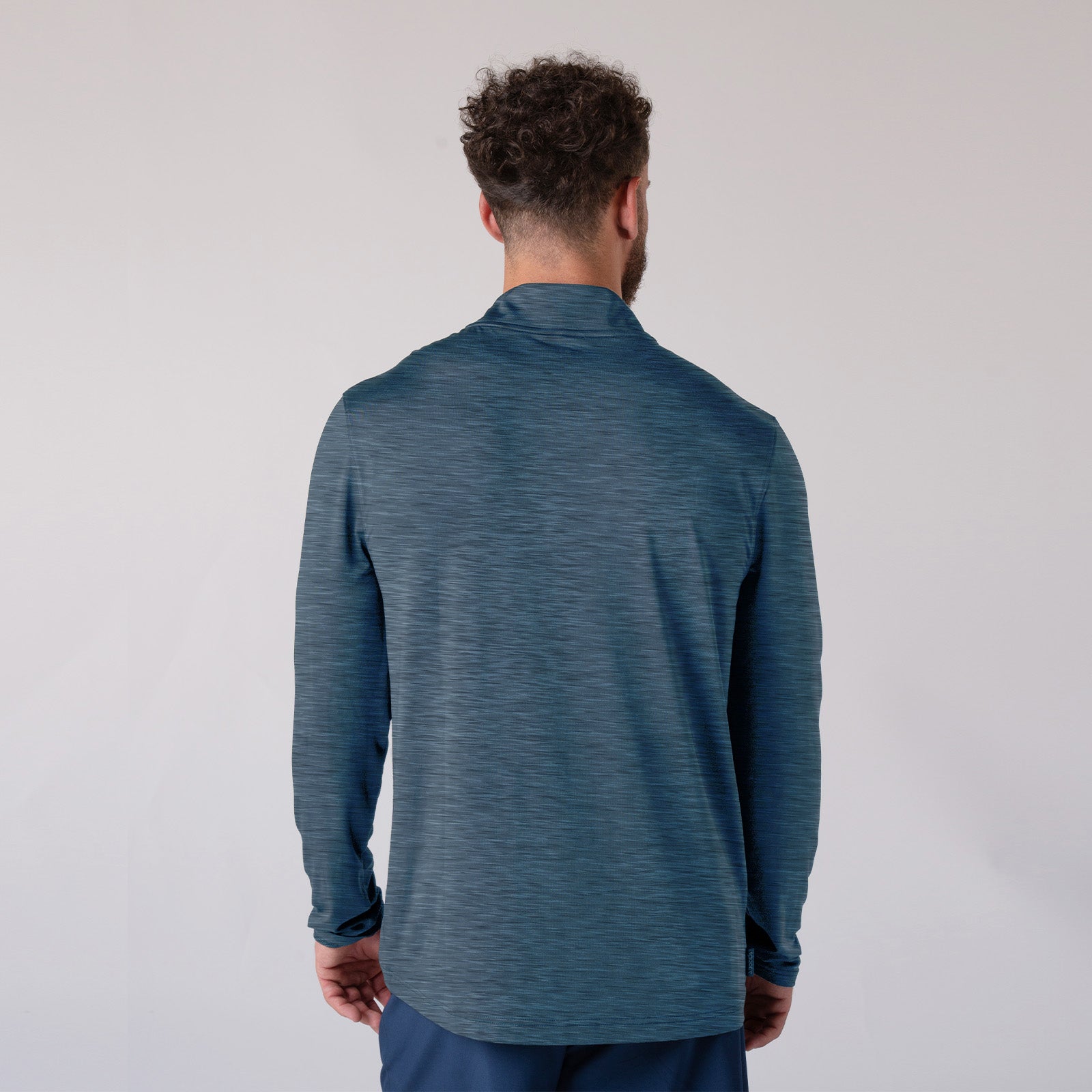 White background image, the back of a model wearing a JOOLA Men's Quarter Zip. Navy.