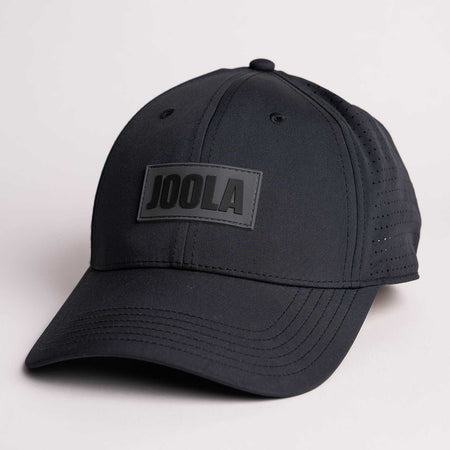 White background, product image of a JOOLA Perforated Cap, Black.
