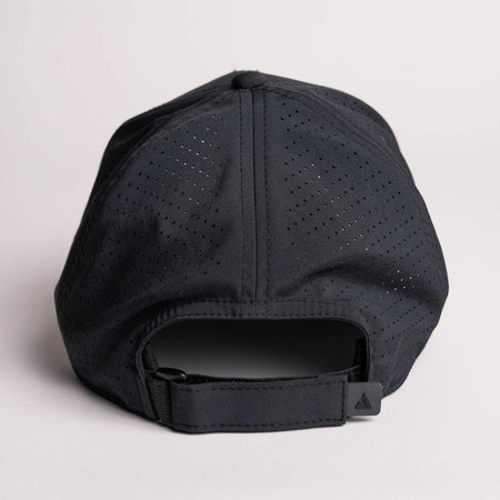 White background, product image showing the back of a JOOLA Perforated Cap, Black.