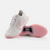 White background photo, image of a pair of JOOLA Women's R4LLy pickleball shoes, pink and white colorway.