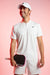 Pink and white gradiant background, image of Ben Johns in White and black JOOLA Apparel holding the Pink Perseus Pro IV.
