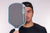 Gray background, image of JOOLA pro Ben Johns with Hyperion Pro V covering half of his face.