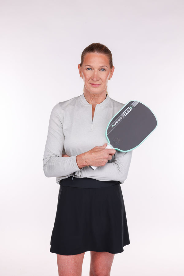 Gray background, image of JOOLA Pro Steffi Graf holding her Graf Pro V.