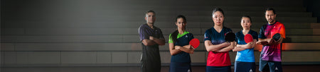 Horizontal header image showing five JOOLA Table Tennis pros each crossing their arms and holding table tennis rackets.