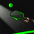 Green JOOLA x Razer pickleball paddle and ball on a dark surface