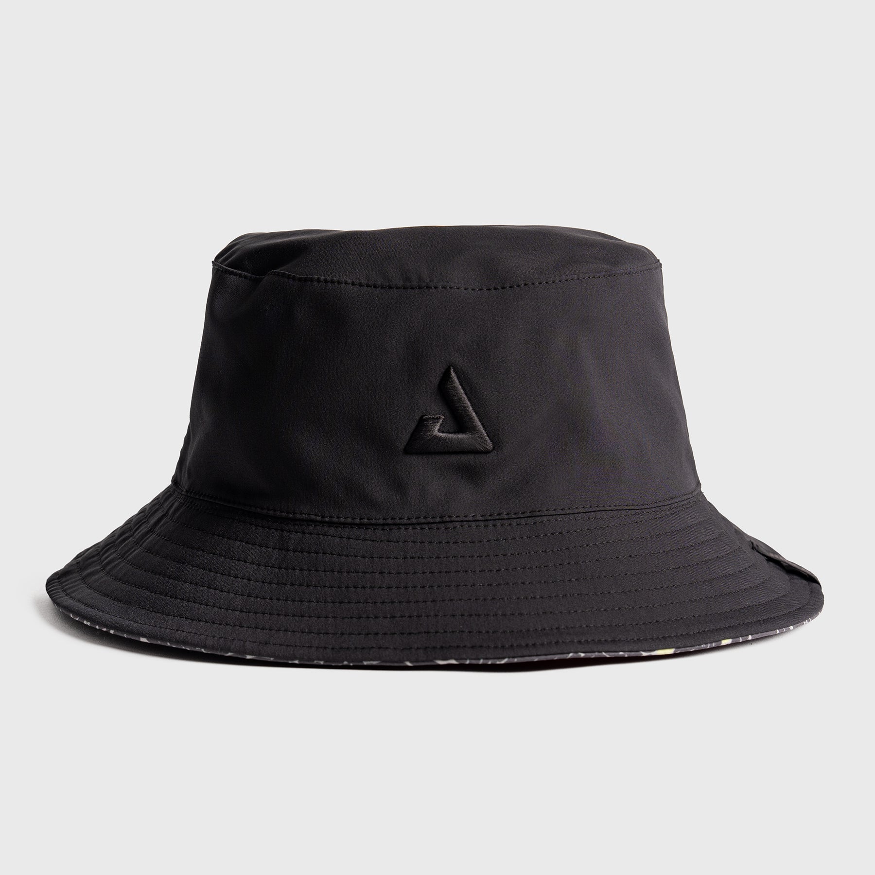 Black bucket hat with a JOOLA trinity logo on a light gray background