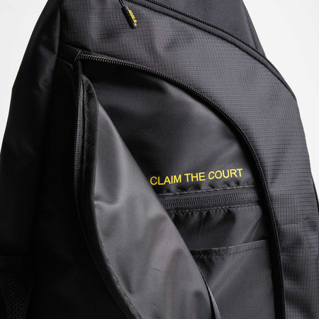 Close up on the inside of the front pocket on the JOOLA Sling bag with the Text 'Claim the Court.'