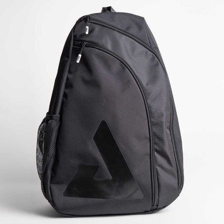 Gray background, product image of a black JOOLA Sling Bag.
