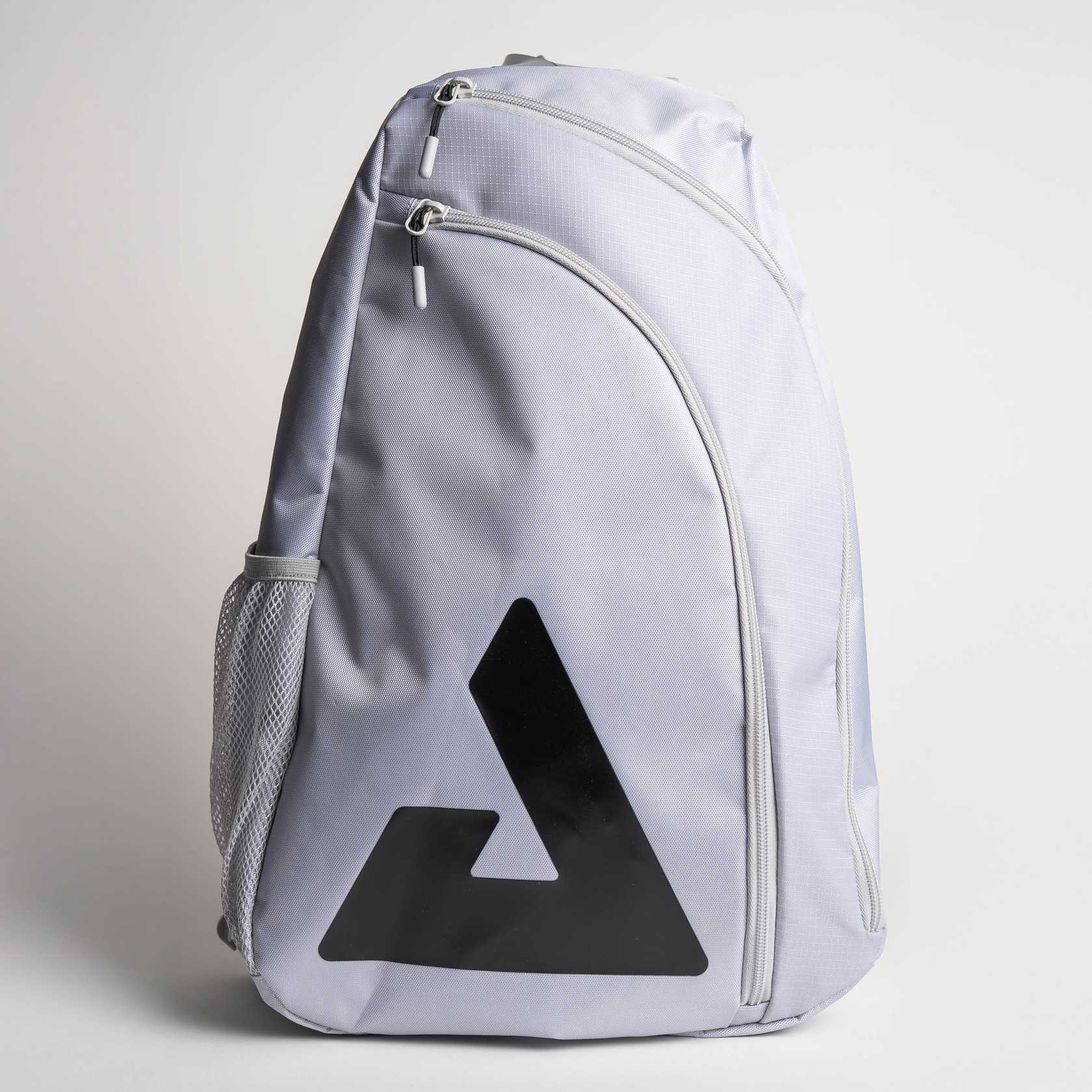 Gray background, image of a gray JOOLA Sling bag with large JOOLA trinity logo on the front.