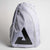 Gray background, image of a gray JOOLA Sling bag with large JOOLA trinity logo on the front.