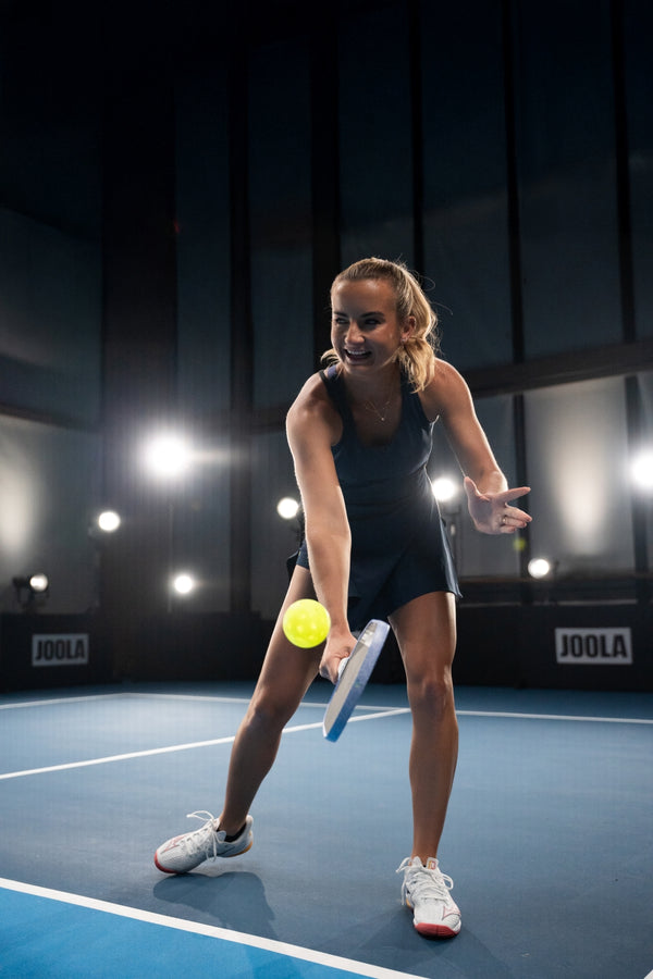 JOOLA Pro Kate Fahey playing pickleball indoor with a Agassi Pro V pickleball paddle.