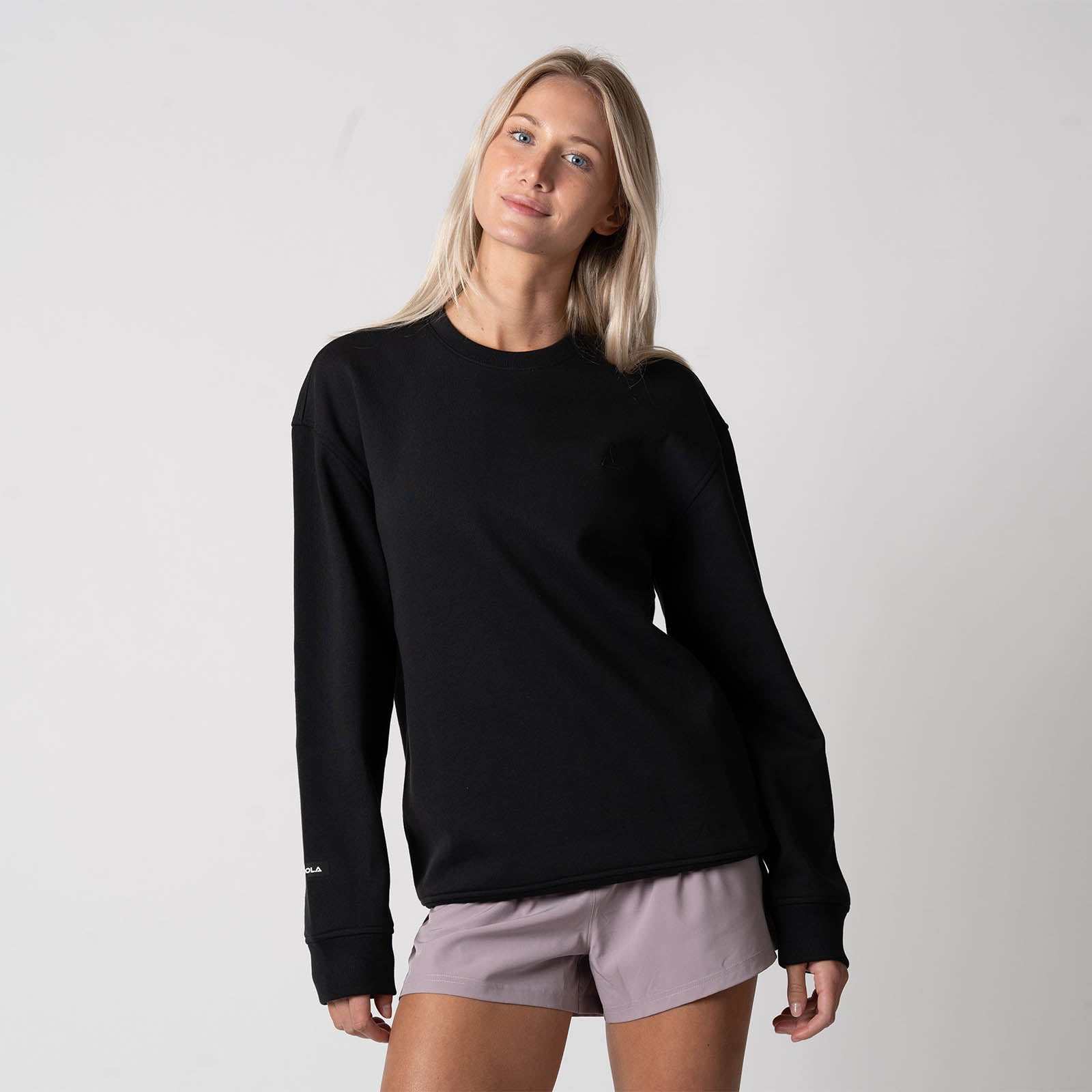 Image of female model wearing a JOOLA Unisex Fleece Crew, Black.