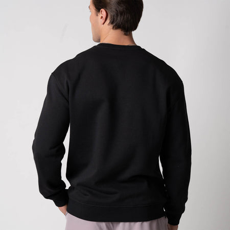 Image showing the back of a male model who is wearing the JOOLA Unisex Fleece Crew, Black.