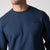 Close up image of the raised JOOLA Trinity logo on the JOOLA Unisex Fleece Crew, Navy.