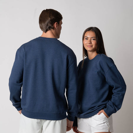 Image showing a female model and a male model each wearing JOOLA Unisex Fleece Crew, navy.