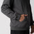 Close up image of male models hand inside the kangaroo pocket of the JOOLA Unisex Fleece Hoodie, Charcoal Heather.