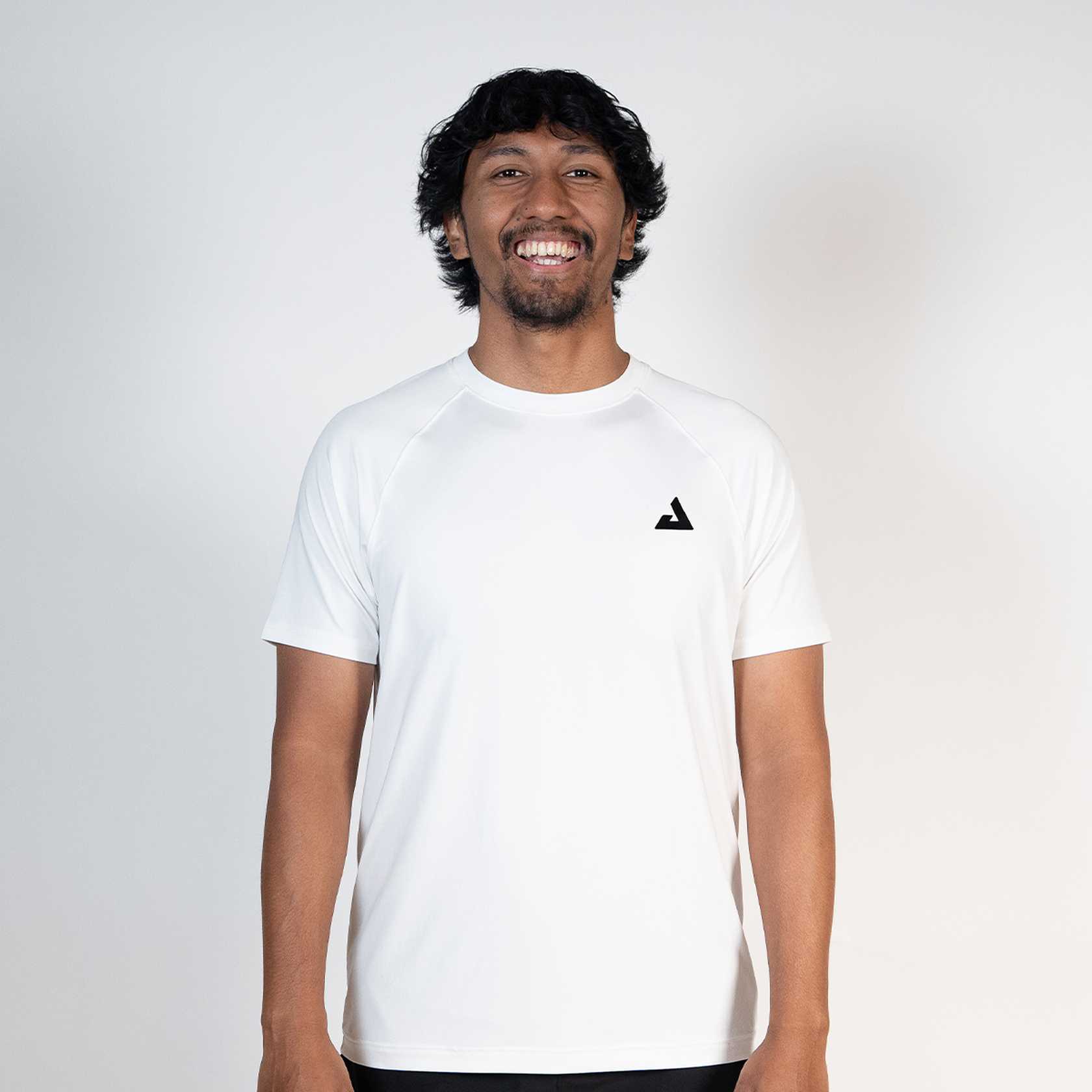 Person wearing a white t-shirt with a black JOOLA Trinity logo on a plain background