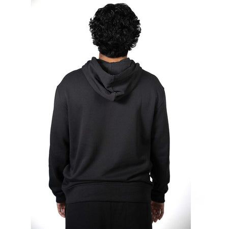 Person wearing a black hoodie from behind on a white background.