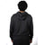 Person wearing a black hoodie from behind on a white background.