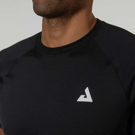 Black athletic shirt with a white JOOLA Trinity logo on a neutral background