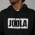 Black hoodie with 'JOOLA' logo on a gray background.
