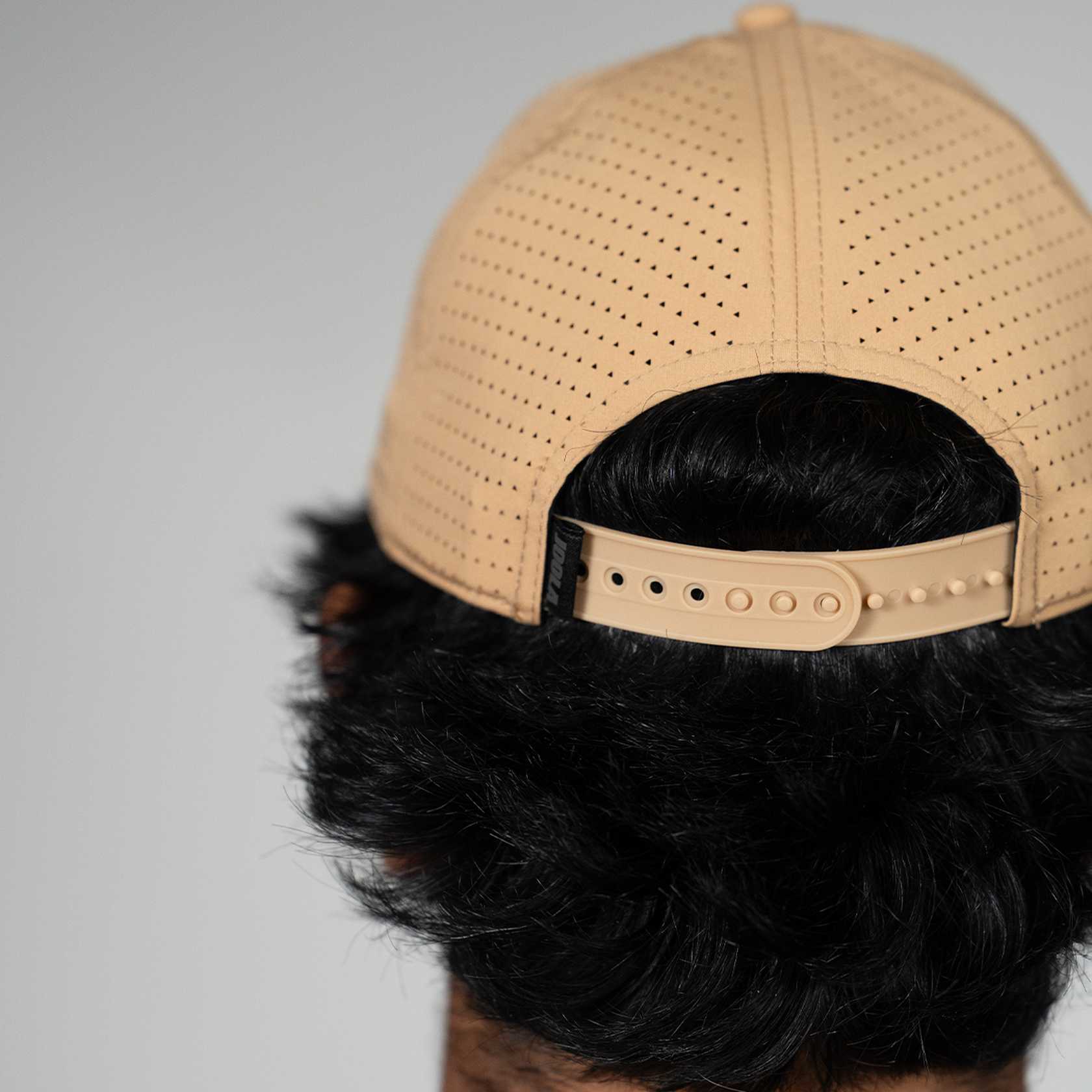 Close up of the back of a JOOLA Latte and Black Cap.