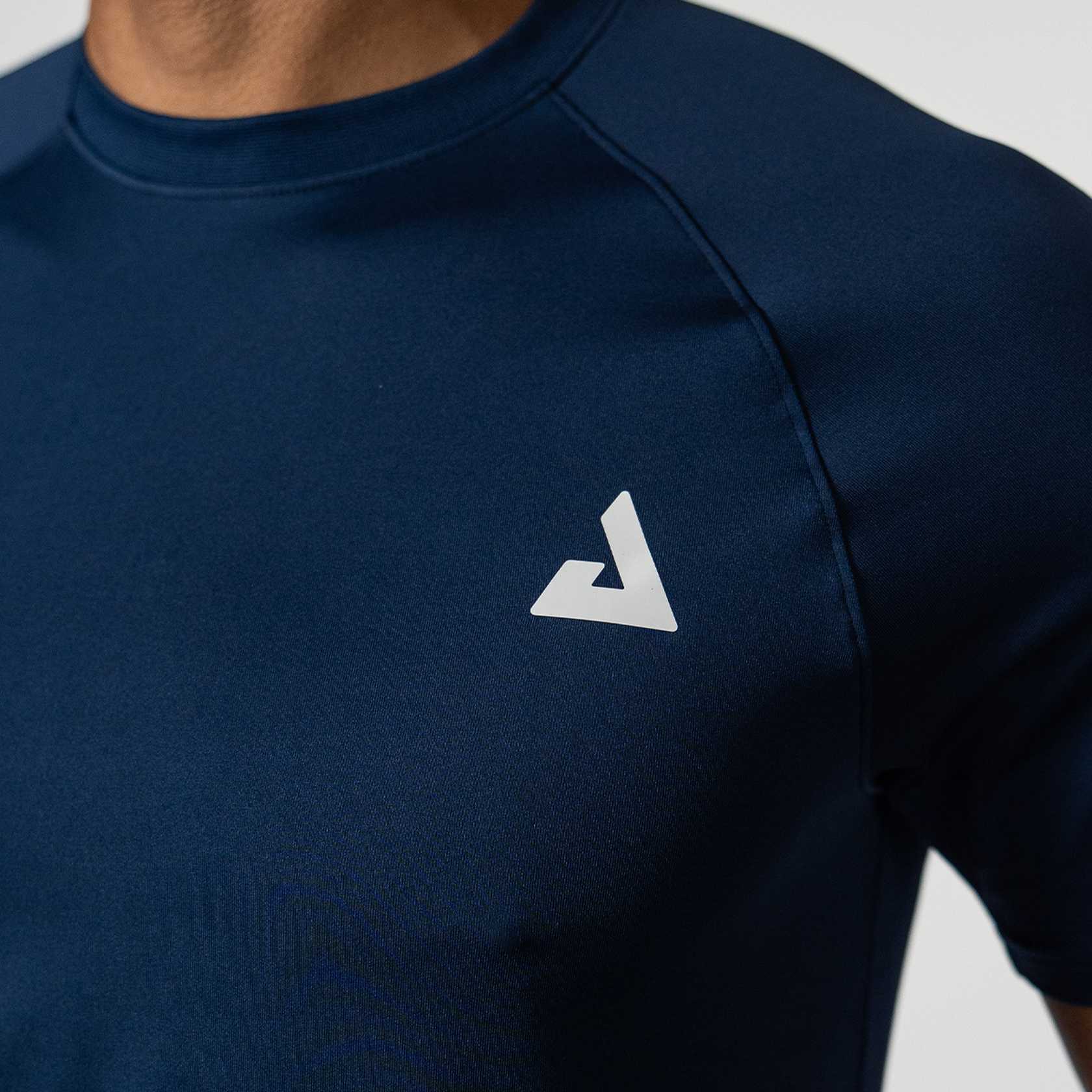 Navy blue athletic shirt with a white JOOLA Trinity logo on a neutral background