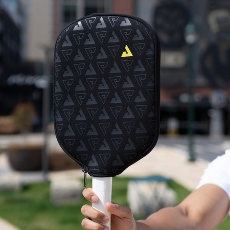 Close up image of the a JOOLA Paddle with the JOOLA Neoprene Universal paddle cover.
