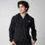 Gray background, model wearing a black JOOLA Half Zip.