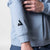 Close up image of the JOOLA trinity logo on the sleeve of a JOOLA hoodie.