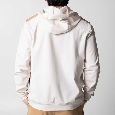 Gray background, the back of a white and latte colored JOOLA zip up hoodie.