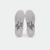 White background, product image showing the bottom of a pair of JOOLA TT SM4SH table tennis shoes, white and gray.
