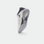 White background, image of a JOOLA TT SM4SH table tennis shoe, shoe is white and navy blue.