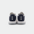 White background, product image showing the back of a pair of JOOLA TT SM4SH table tennis shoes, white and navy blue colorway.