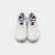 White background, top view of a pair of JOOLA TT SM4SH table tennis shoes, navy blue and white colorway.