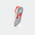 White background, image showing the bottom of a pair of JOOLA TT SM4SH table tennis shoes, white and red colorway.