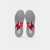 White background, product image of showing the bottom of a pair of JOOLA TT SM4SH table tennis shoes, red and white colorway.