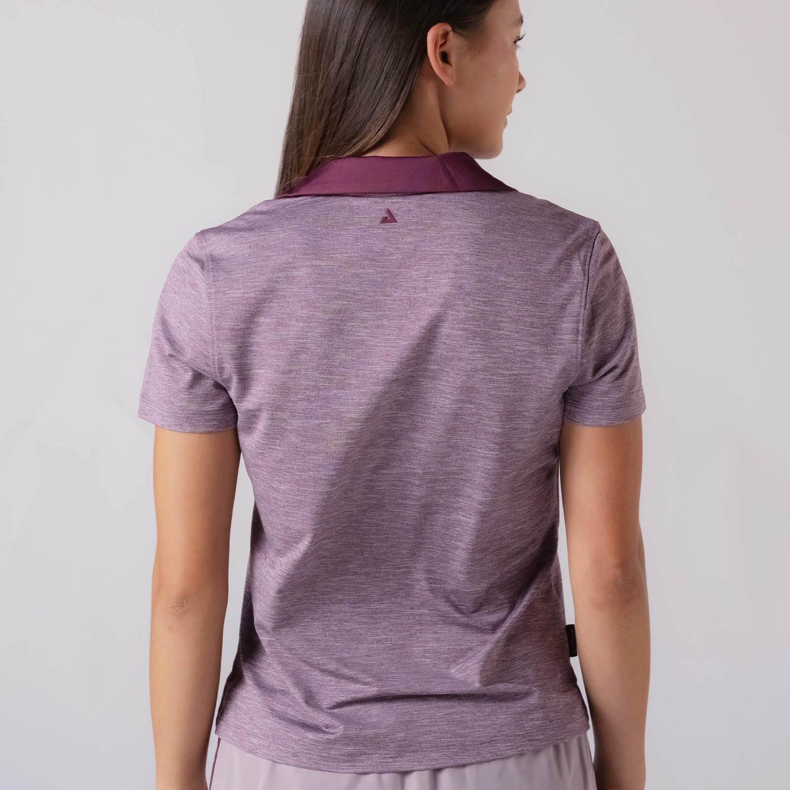 Image showing the JOOLA Trinity logo detail on the back of a JOOLA Women's Club Polo, Bordeaux heather.