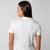 Image showing the back of a female model wearing a JOOLA Women's Club Polo, White.