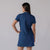 White background image, female model showing the back of a JOOLA Women's Club Polo dress. Navy.