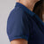 Close up image of the right shoulder of the JOOLA Women's Club Polo Dress. Navy.