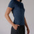 Image showing the side profile of a JOOLA Women's Club Short Sleeve shirt. Navy.