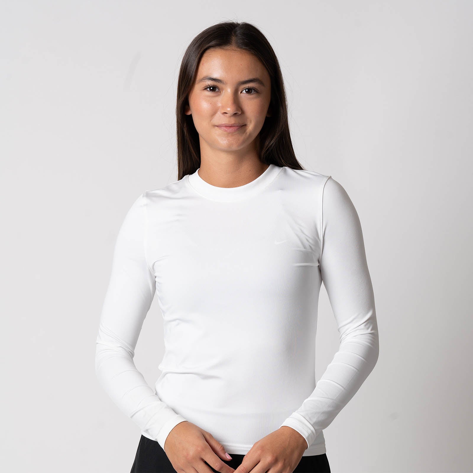 Image of a female model wearing a JOOLA Women's Court long sleeve shirt, white. 