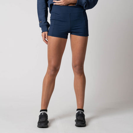 Female model showing off the JOOLA Women's Knit Shorty Shorts, Navy.