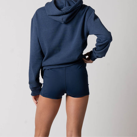 Close up image of the back side of pair of JOOLA Women's Knit Shorty Shorts, navy.